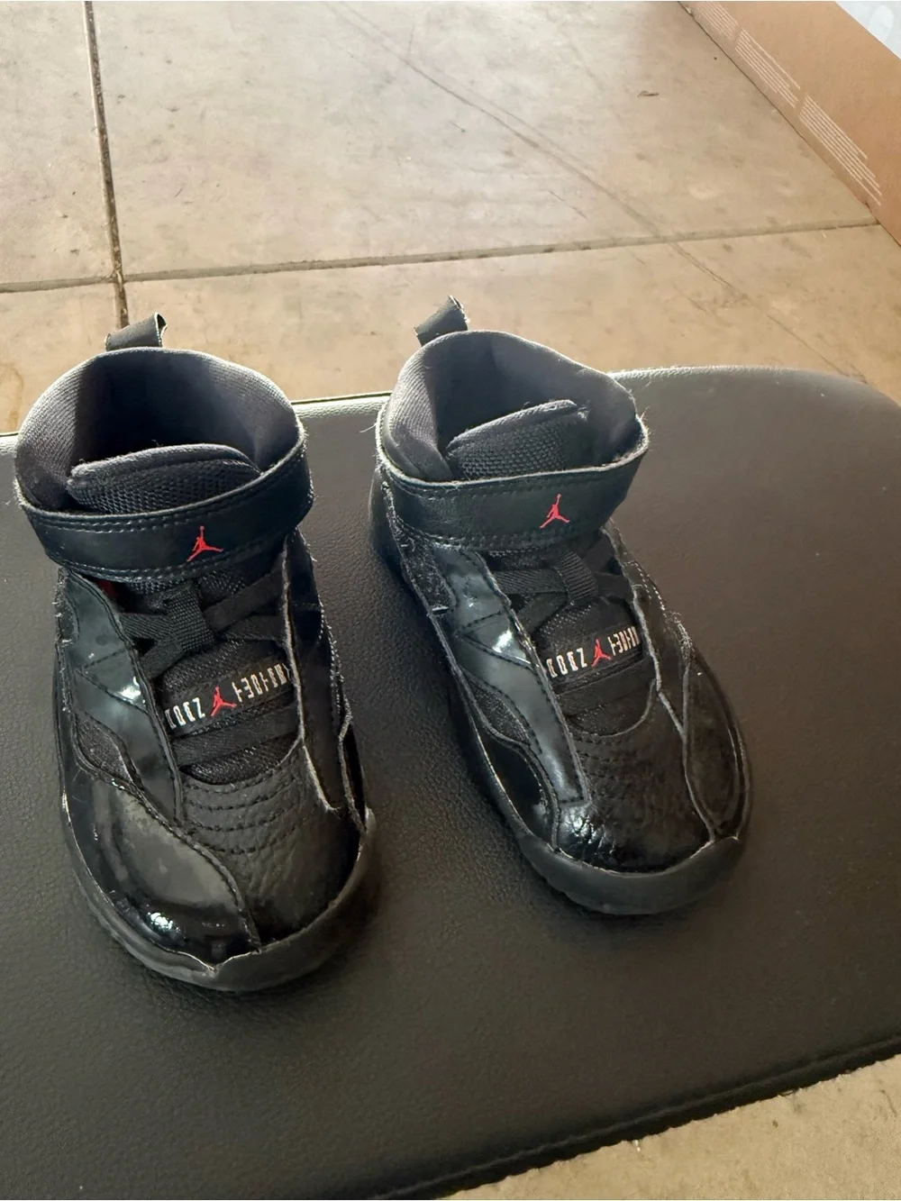Jordan Kids Black High-Top Sneakers with Red Jumpman Detail